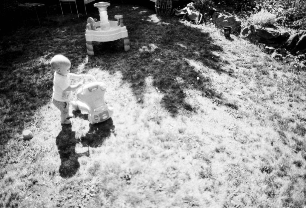 Child plays in the backyard. This shows the latitude that this film holds. It was a bright day and you can see both highlight and shadow detail. Canon EOS 3, Canon 24mm f1.4 lens