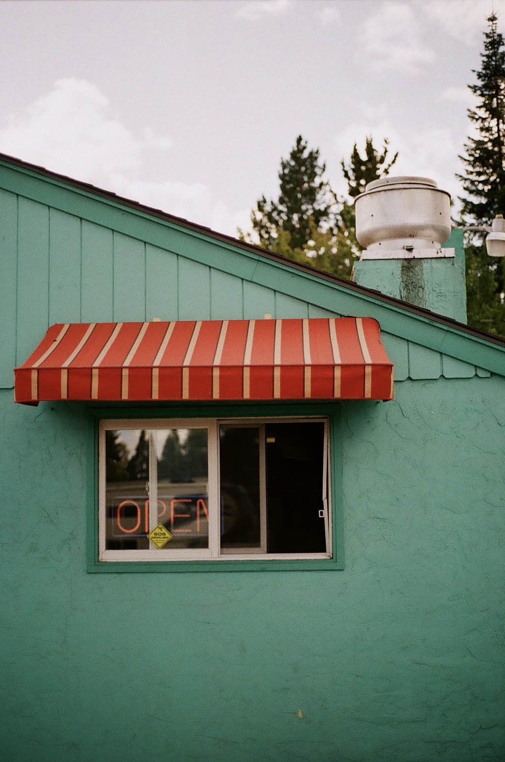 Lomography 400 ~ Canon AE-1 ~ Canon 50mm F1.8 When something catches your eye and you have to pull over to grab a shot. A small Mexican restaurant is open for business
